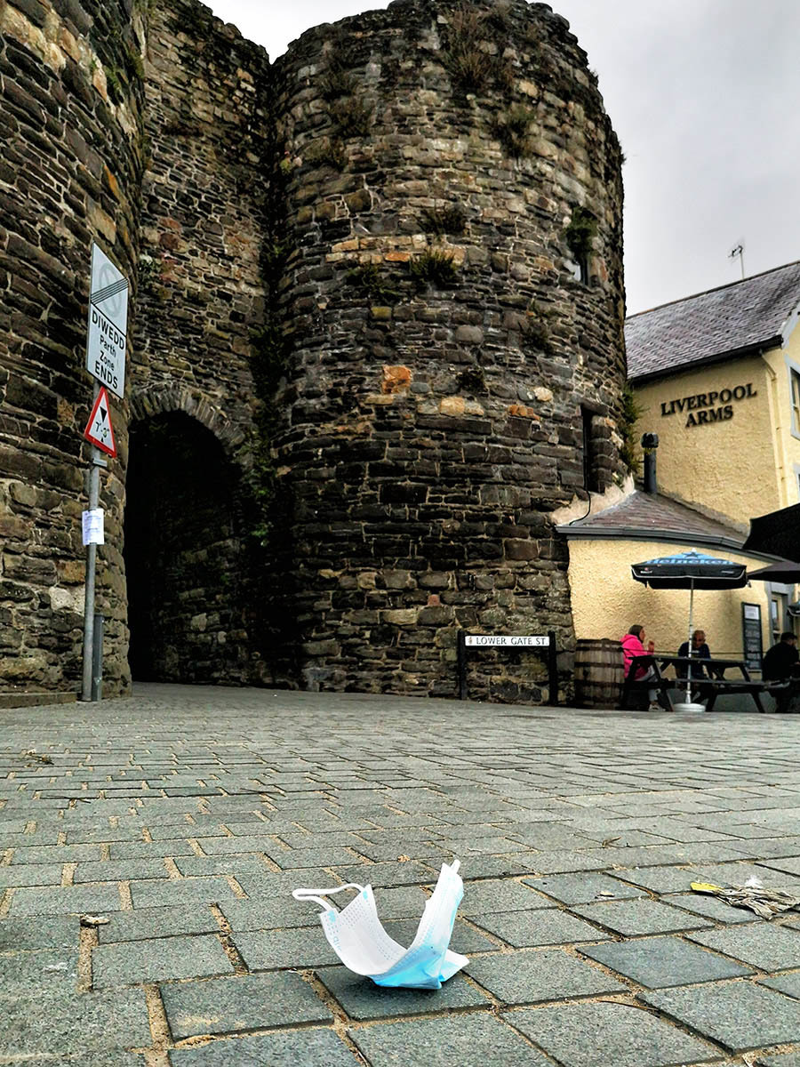 Mask and medieval gateway Conwy by Rhodri Clark