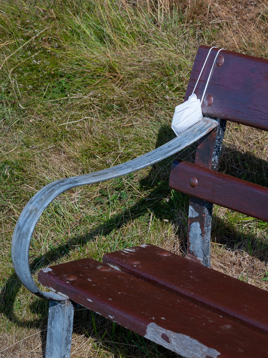 Mask on bench Llandudno by Stuart Tudno Jones