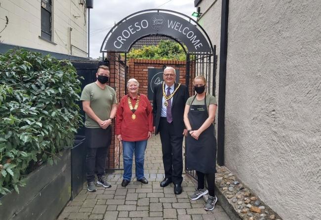 Mayor of Rhuddlan Arwel Roberts with the owners of Green Island Bistro in Rhuddlan.