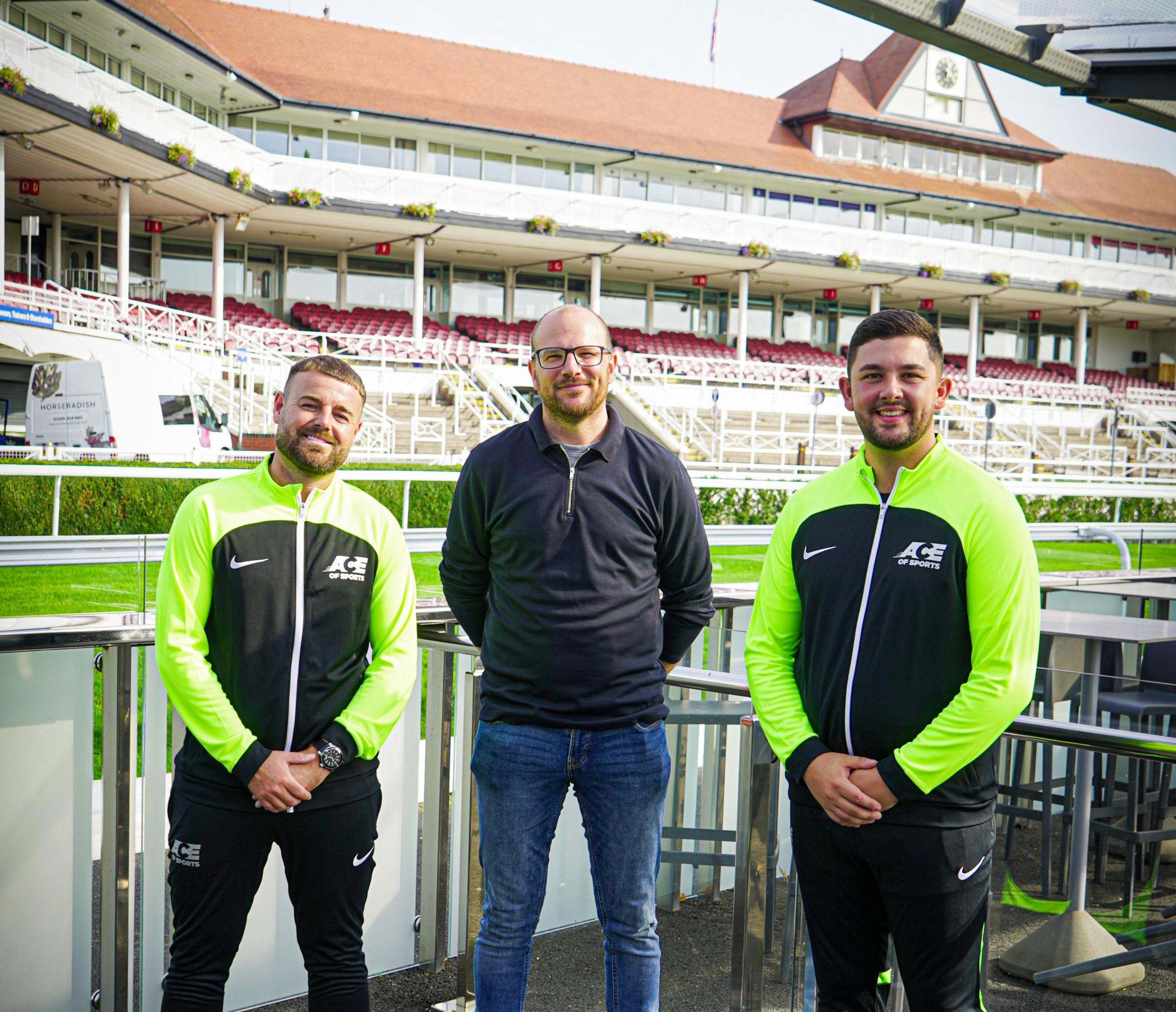 John Jones and George Deniz from Ace of Sports, with darts champ and Sky pundit Mark Webster, at Chester Racecourse.