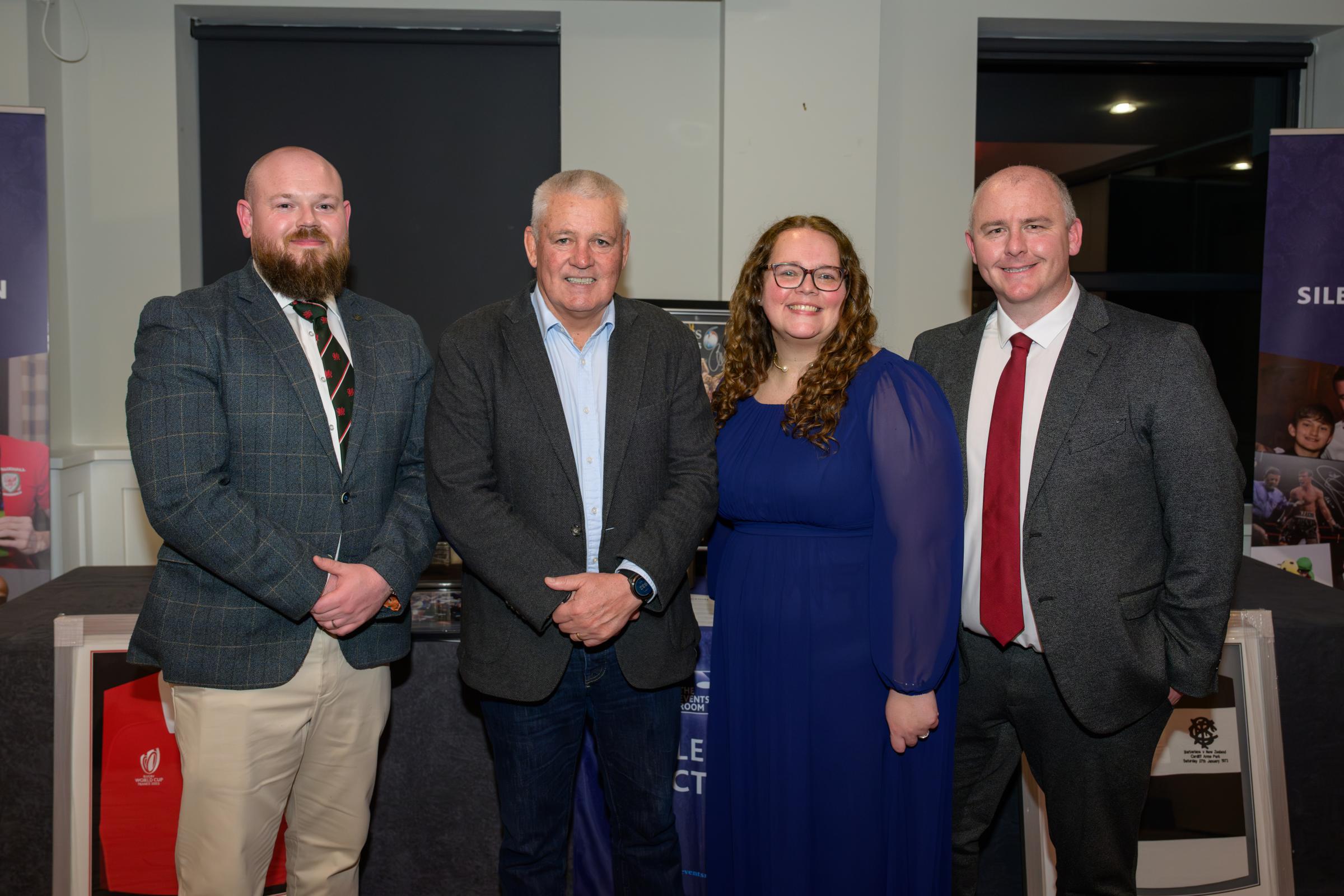 Rob Lewis and Jamie Hughes of Celtic Financial Planning flank Warren Gatland and Vanessa Marubbi