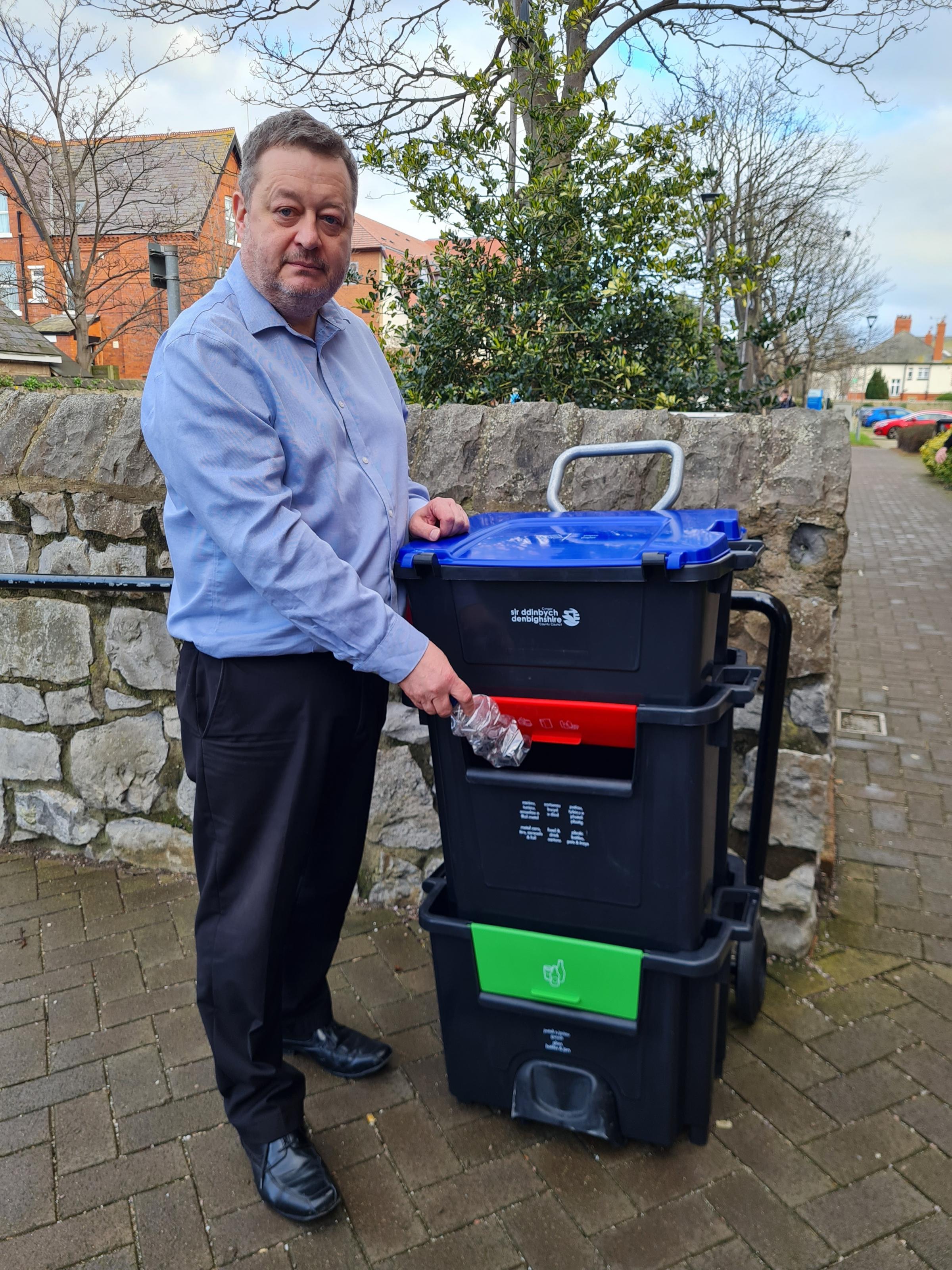 Denbighshire leader Cllr Jason McLellan with one of the councils new recycling ‘Trolibocs on wheels’ - to replace their blue bin..