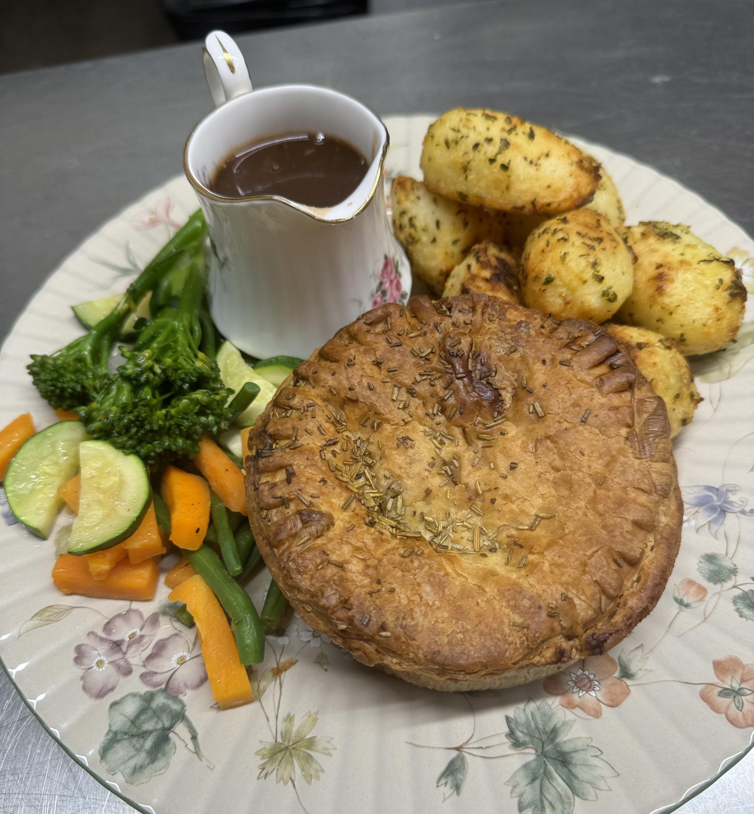 Pie and toasted potatoes with veg.